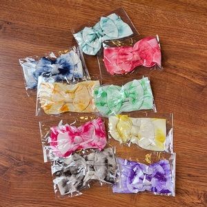 9 unopened baby tie dye headband bows